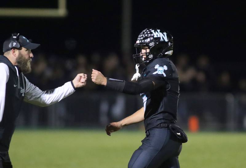 Woodstock North’s Parker Halihan is greeted after a touchdown against Woodstock in varsity football at Woodstock North High School on Friday, October 24, 2025.