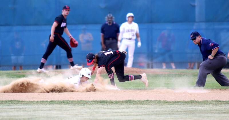 Huntley’s Griffin Goldstein tags Jacobs’ Nathan Gerritsen out at second base in Class 4A Sectional baseball action at Carpentersville Wednesday.