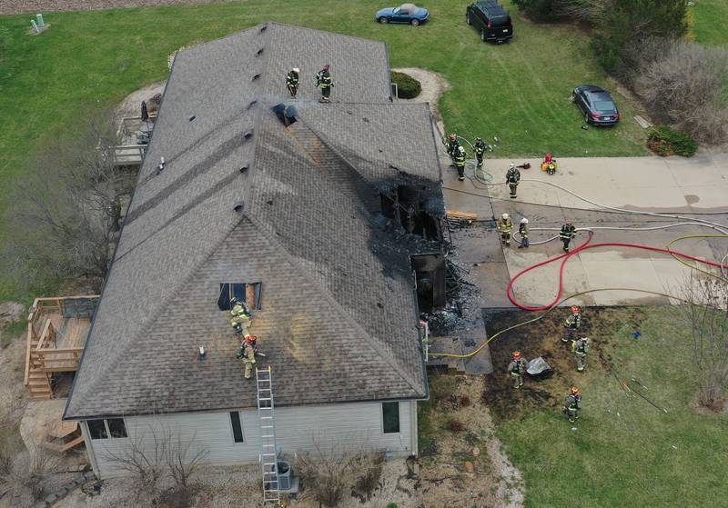 Firefighters work the scene of a structure fire in the 600 block of U.S. Route 6 on Tuesday, April 1, 2025 in La Salle. Fire departments from Peru, La Salle, Utica, Troy Grove, Wallace, Spring Valley and Oglesby were dispatched just before 2:30 to a one-story dublex home.