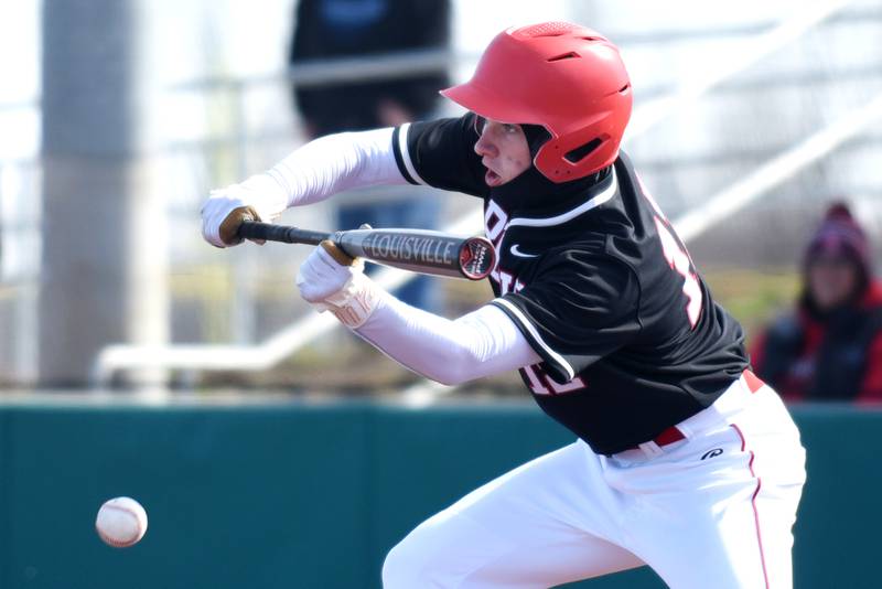 Bradley-Bourbonnais' Cooper Daugherty bunts the ball during a game against Bishop McNamara at 315 Sports Park in Bradley Saturday, March 28, 2026.