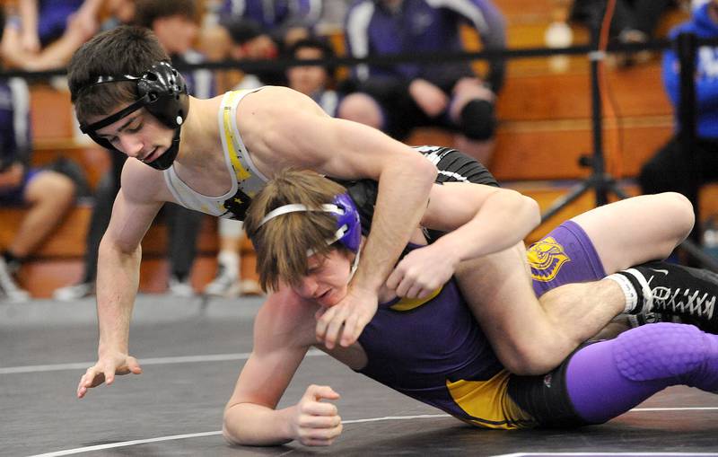 Yorkville Christian's Drew Torza turns Mendota's Rhett Watson in a 145-pound bout during the Class 1A Wrestling Regional at Plano High School on Saturday, Feb. 4, 2023.