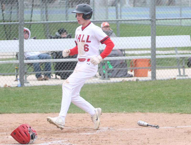 Hall's Hunter Edgcomb scores a run against Ottawa on Tuesday, April 1, 2025 at Ottawa High School.
