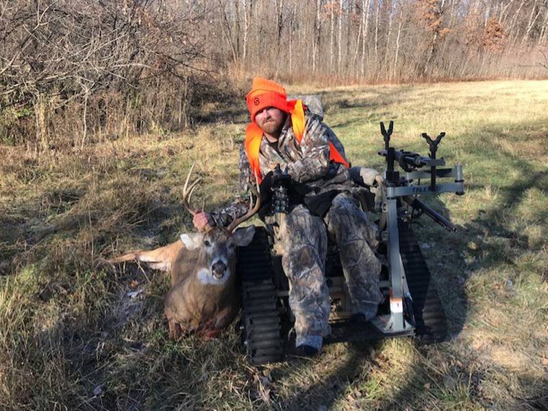 Tyler Ogburn from White Springs, Florida poses with the eight-point buck he harvested during 16th annual Lost Mound deer hunt for persons with physical disabilities.