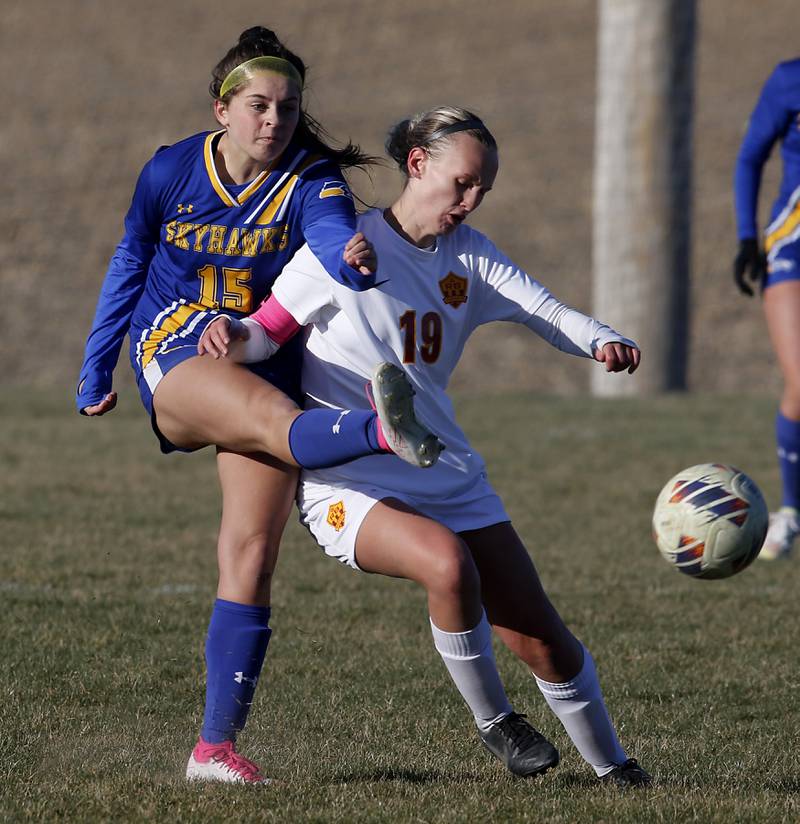 Johnsburgs Lauren McQuiston kicks the ball away from Richmond-Burton’sLayne Frericks during a Kishwaukee River Conference soccer game on Wednesday, March 20, 2024, at Johnsburg High School.