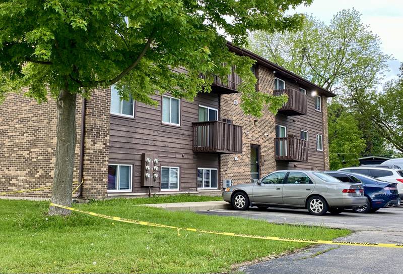 Crime scene police tape ropes off a portion of the parking lot off on Wednesday, May 28, 2025, at Russell Road Apartments, 822 Russell Road, DeKalb. One person suffered serious injuries in a mid-afternoon shooting outside the building, DeKalb Police Chief David Byrd said.