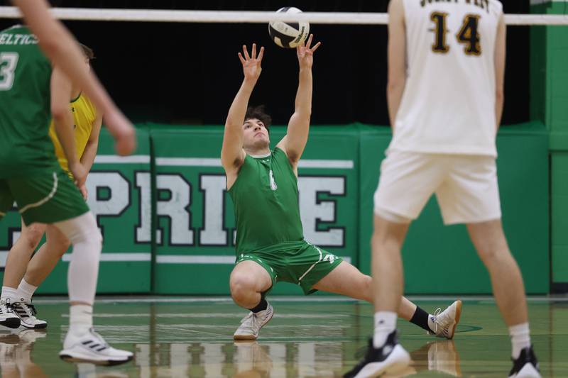 Providence’s Isaac Krabbe goes low for the ball against Joliet West on Tuesday, April 16, 2024 in New Lenox.