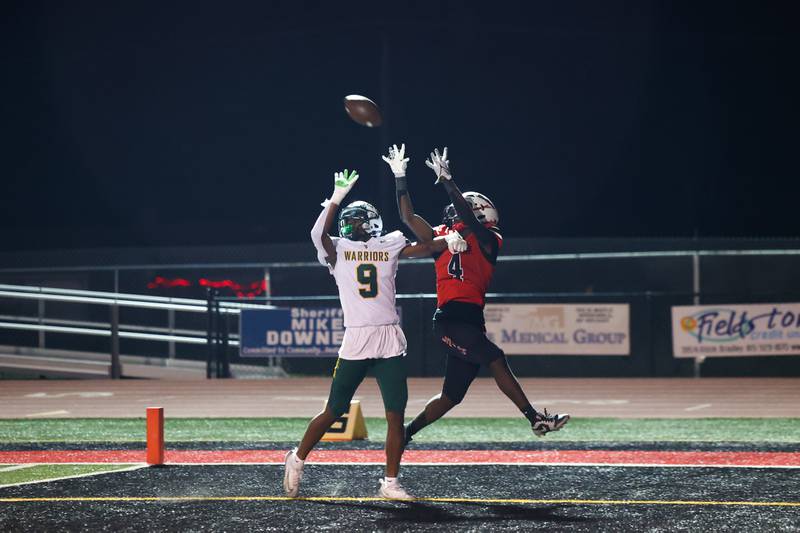Bradley-Bourbonnais' Jamir Burt attempts an end zone catch under pressure from Waubonsie Valley's Nonye Onuchukwu, left, during the Boilermakers' 35-6 victory over Waubonsie Valley Friday, Sept. 12, 2025.