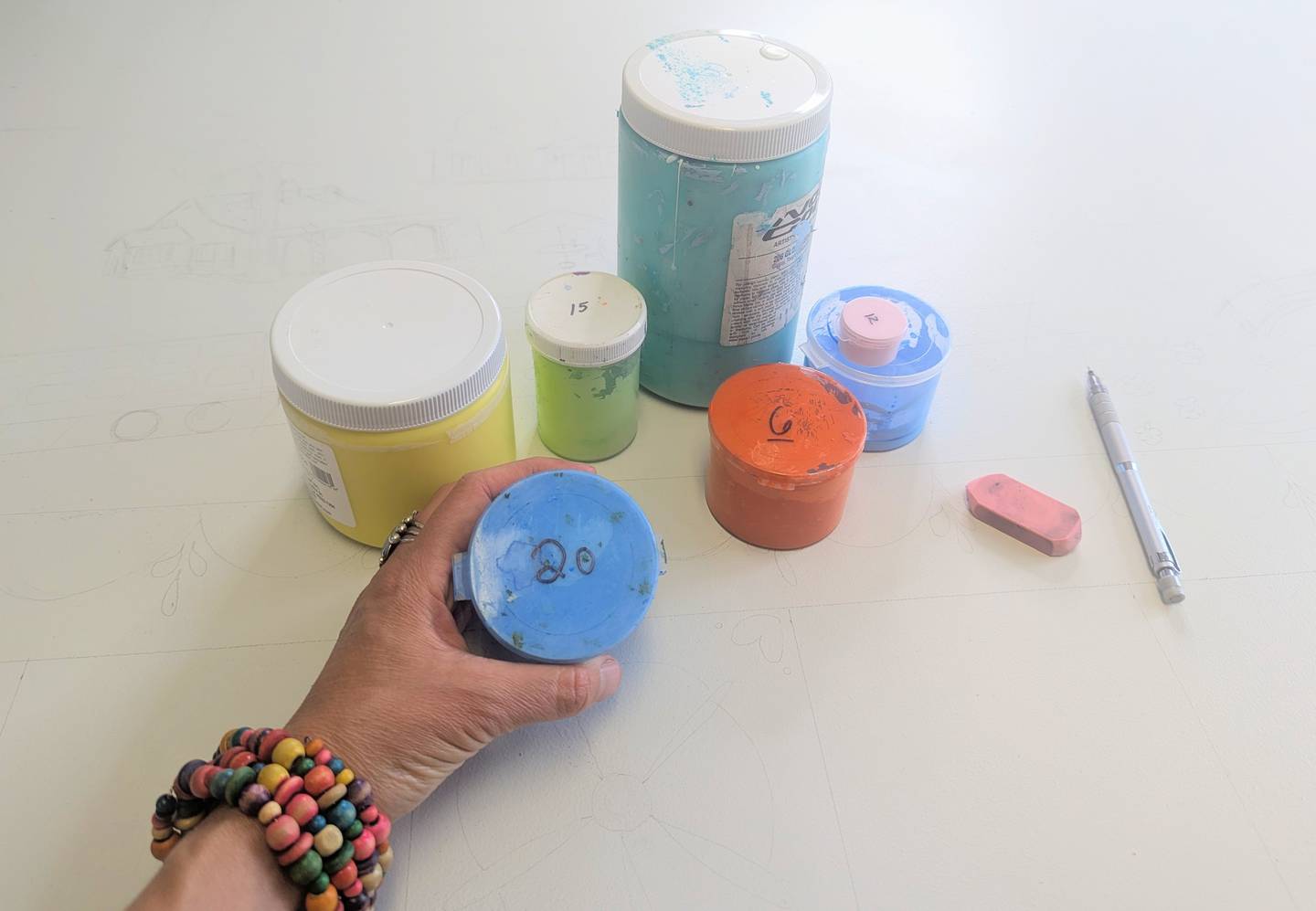 Aurora artist Laura Lynne starts the numbering process for paints to be used in the paint-by-number mural project for the Geneva Chamber of Commerce.