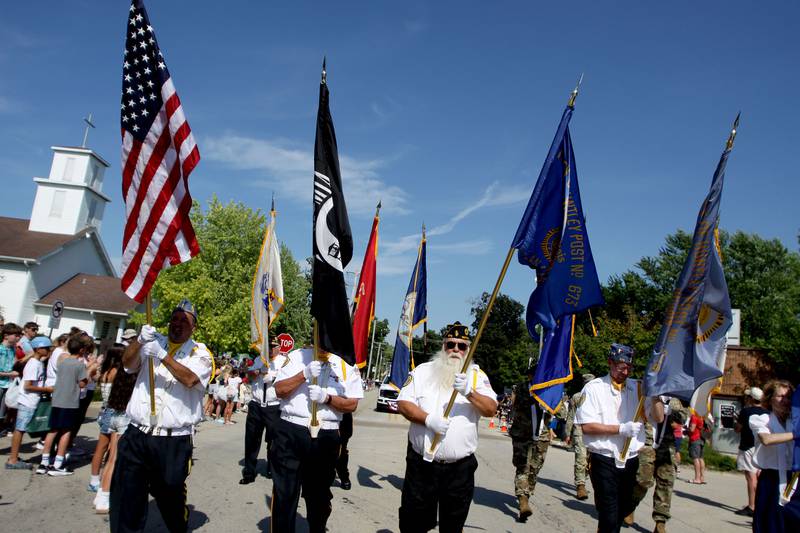 Veterans march to begin the Huntley Independence Day Parade along Main Street in Huntley on Friday, July 4, 2025.