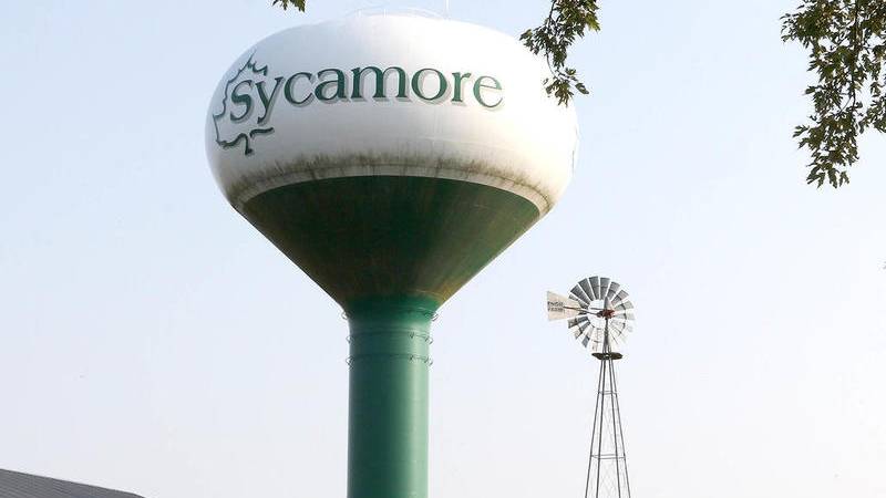 The Sycamore water tower rises over the barns on the grounds of the Sycamore History Museum.