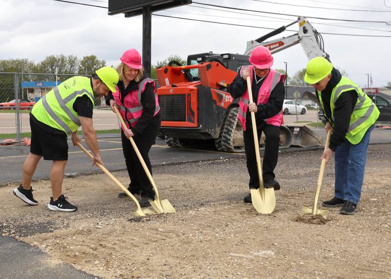 Tom & Jerry’s general manager Josh Osenga, (L-R) general manager Sarah Meyer, owner Diann Beaulieu and owner Thomas Beaulieu scoop up some dirt Friday, May 1, 2026, during a groundbreaking ceremony to kick off the rebuilding of the restaurant at its previous location of 1670 DeKalb Avenue in Sycamore. Tom & Jerry’s was destroyed by a fire on January 31 and is currently operating at its temporary location at 265 West Peace Road in Sycamore.