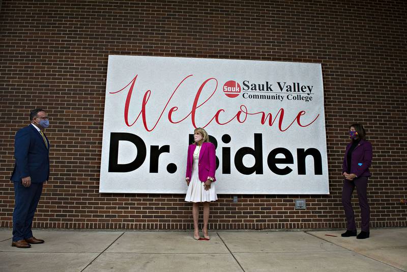 2021 FILE: First lady Jill Biden speaks with Miguel Cardona, secretary of education and Congresswoman Cheri Bustos after arriving at Sauk Valley Community College to learn about new programs the school is offering.