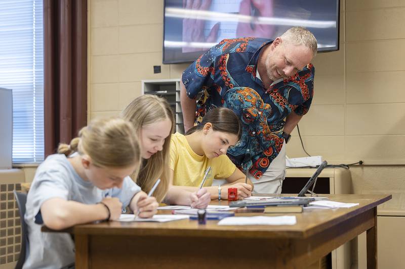 Sterling Challand Middle School art teacher Scott James teaches a technique on shading to his 6th grade students.