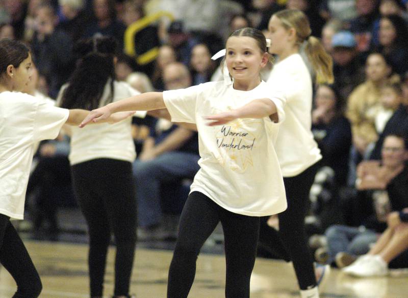 McKinley Shipma performs at halftime with the 9-12 Kiddie Camp group.Kiddie Camp was run by the SHS Poms.
