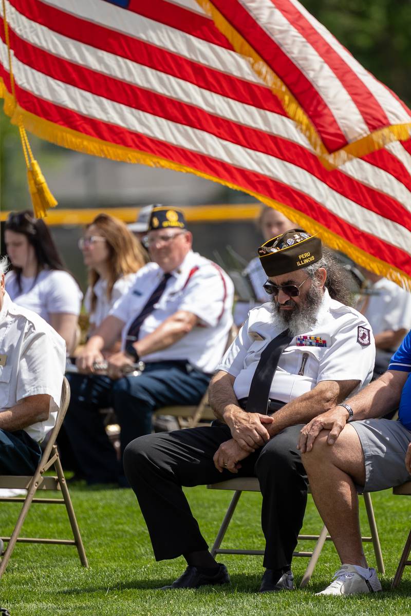 Andy Ruggerio of the Peru Honor Guard bows head during moment of silence on Monday, May 26, 2025 at Washington Park in Peru.