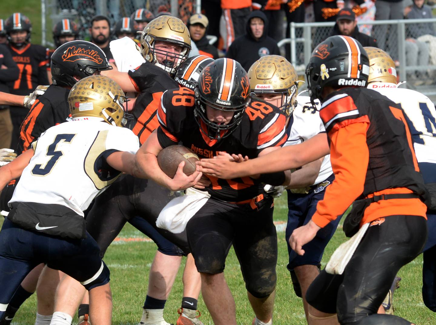 Milledgeville's Karter Livengood (48) carries the ball for a gain during 8-man playoff action against Polo on Saturday, Nov. 16, 2024 at Milledgeville.