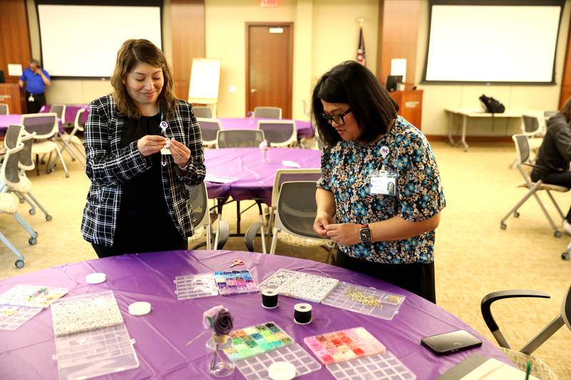 Daisy Borjon (left) and Cherise Dizon make friendship bracelets as part of Northwestern Medicine Central DuPage Hospital’s National Nurses Week activities in Winfield on Monday, May 6, 2024.