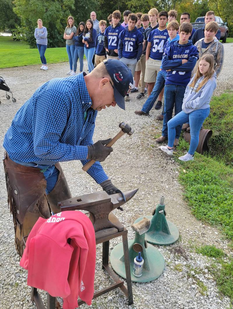 Professional horseshoer Don Haag of Pontiac shows the Marquette FFA class how to hammer and shape a new horseshoe on Friday, Oct. 6, 2023, in Ottawa.