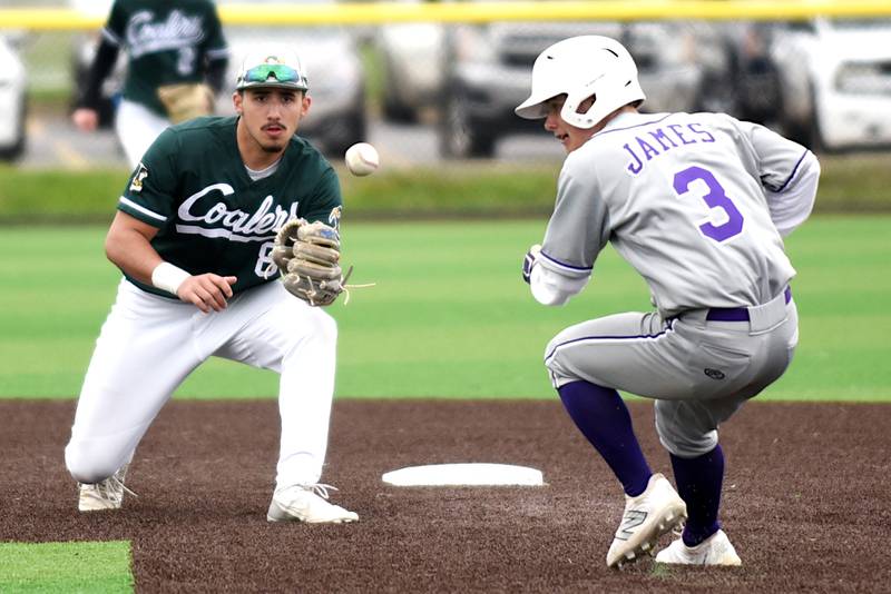 Coal City's Gabe McHugh, left, fields a throw at second base as Wilmington's Shawn James approaches during a game at Coal City Monday, April 21, 2025.