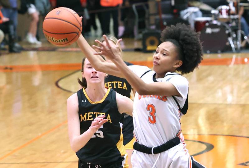 DeKalb's Madison McNeil grabs a rebound in front of Metea Valley's Caitlin Clish during their game Thursday, Jan. 19, 2023, at DeKalb High School.