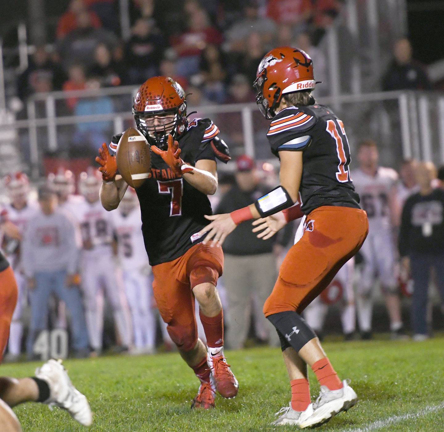 Fulton's Jacob Jones gets a handoff from quarterback