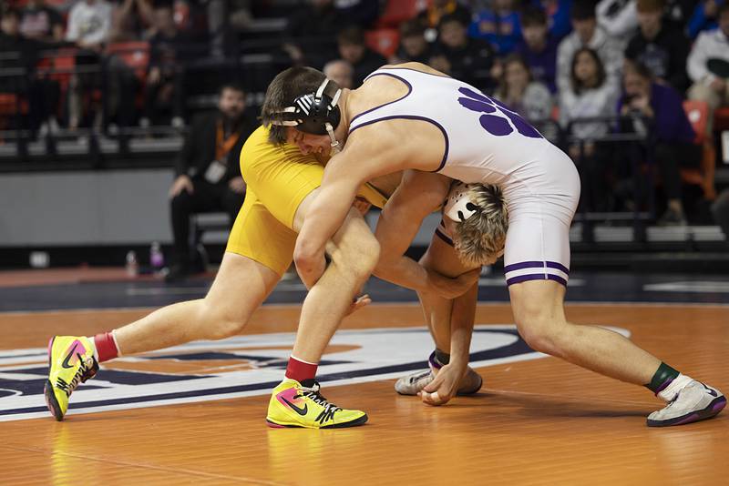 Wilmington’s Logan VanDuyne (right) and Lena-Winslow’s Eli Larson compete in the 1A 190 pound class  Saturday, Feb. 21, 2026, at the IHSA wrestling finals in Champaign.