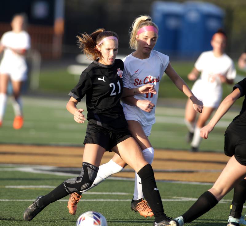 Wheaton Warrenville South’s Ashlyn Adams gets control of the ball during a game against St. Charles East in Wheaton on Tuesday, April 18, 2023.
