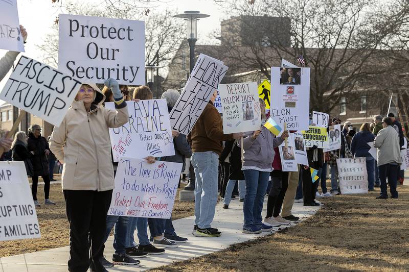 Signs ranged on topics of President Trump, Elon Musk and DOGE, immigration, transgender issues and Ukraine during the protest Tuesday, Feb. 25, 2025, in Sterling.