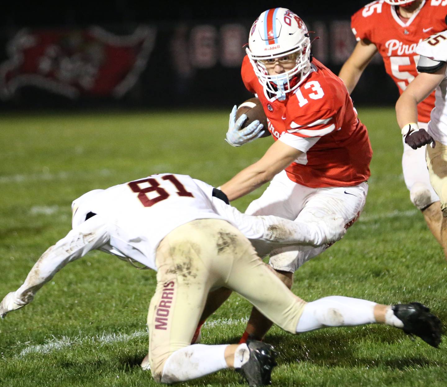 Ottawa's Ryder Miller carries the ball as he avoids the tackle of Morris's Bryce Varner on Friday, Oct. 13, 2023 at King Field.
