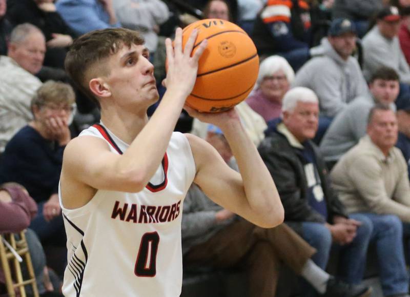 Woodland's Noah Decker takes a wide-open jump shot over Marquette during the Tri-County Conference Tournament championship on Friday, Jan. 30, 2026 at Putnam County High School.