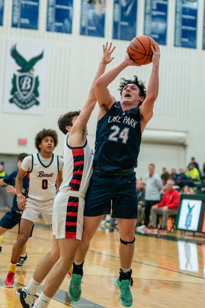 Lake Park's Dennasio LaGioia (24) shoots the ball in the post against Benet’s Sam Driscoll (1) during a Bartlett 4A Sectional semifinal boys basketball game at Bartlett High School on Tuesday, Feb 28, 2023.