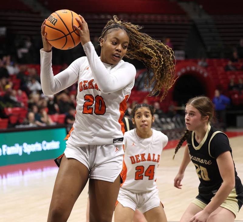 DeKalb's Zora Watts grabs a rebound in front of Sycamore's Callie Countryman Friday, Jan. 30, 2026, during their game in the FNBO Challenge in the Convocation Center at Northern Illinois University in DeKalb.