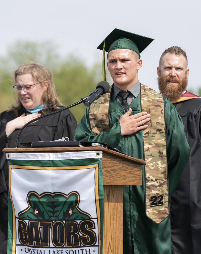 Graduate Lukas Bjork leads the pledge of allegiance during a graduation ceremony for the class of 2022 on Saturday, May 14, 2022, at Crystal Lake South High School in Crystal Lake.