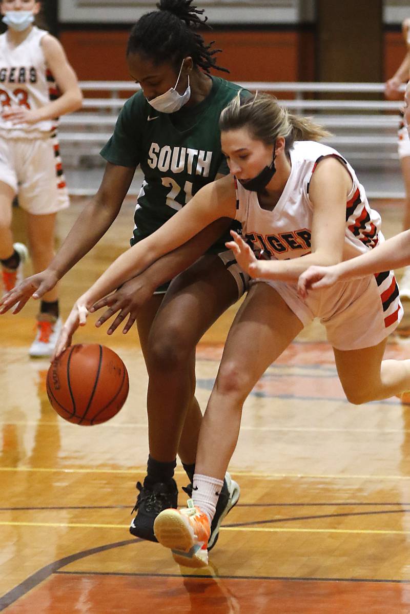 Crystal Lake South's Skyler Mokry tries to beat Crystal Lake Central's Isabelle Szela to the ball during a Fox Valley Conference game Wednesday, Jan. 26, 2022, between Crystal Lake South and Crystal Lake Central at Crystal Lake Central High School.