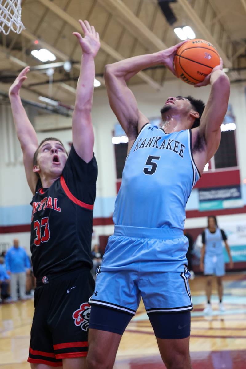 Kankakee's EJ Hazelett shoots under pressure from Lincoln-Way Central's Micah Evans during the Kays' 54-50 victory over Lincoln-Way Central in the 75th Kankakee Holiday Tournament maroon bracket championship on Sunday, Dec. 28, 2025.