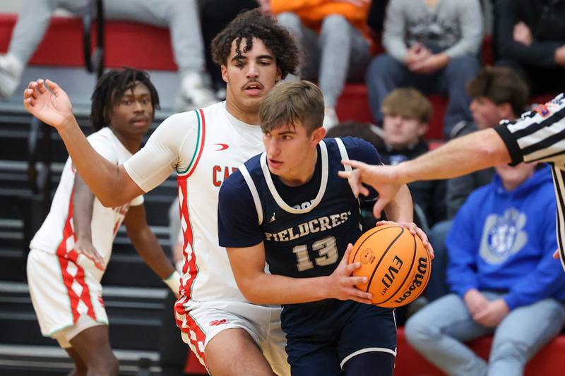 Layten Gerdes of Fieldcrest holds ball on Saturday, December 14, 2024 at Hall High School in Spring Valley.