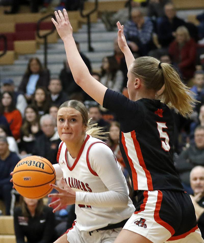 Huntley's Anna Campanelli drives to the basket against Libertyville's Elinor Lindal during the IHSA Class 4A Huntley Sectional Championship girls basketball game on Thursday, Feb. 27, 2025, at Huntley High School.