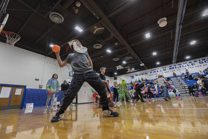Kallin Kester, sixth grader, lobs a ball at his competitors Saturday, Nov. 19, 2022 during Rock Falls Chamber’s Grinch dodgeball.