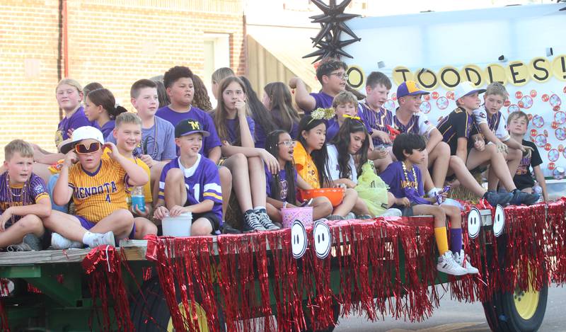 Mendota Holy Cross students ride down Indiana Avenue during the homecoming parade on Friday, Oct. 3, 2025