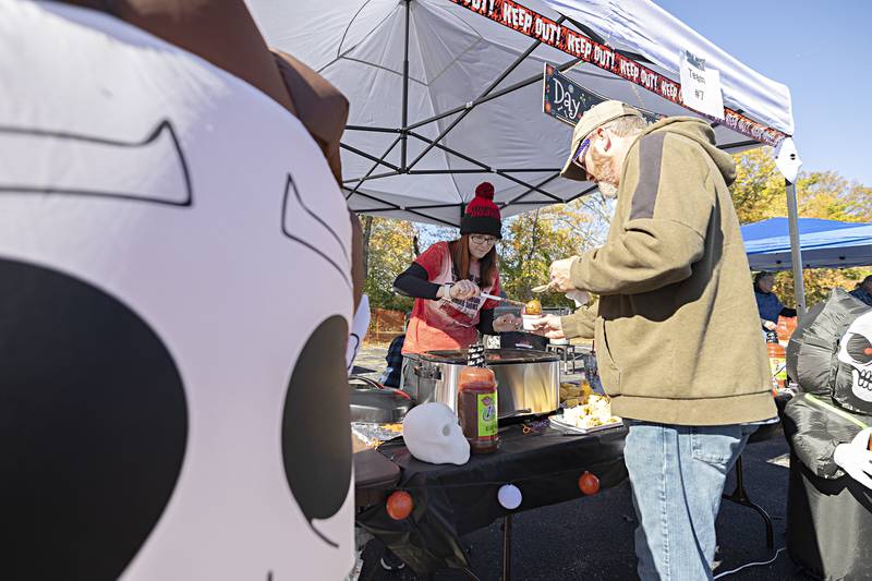 Nakia Van Drew serves chili at her booth “Killer Chili” Sunday, Oct. 22, 2023 at the Elks Club in Dixon. Van Drew cooks with Nick Meakins and his sister Jami Meakins.