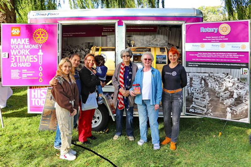 Tetyana Torzhevska, Karen Hutchings, and Nancy Hufty, Rotarians, explained the Iron Lung traveling museum to Fall Fest-2021 visitors at Deicke park in Huntley.
