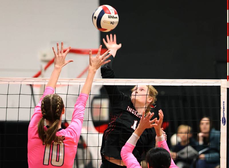 Indian Creek's Allie Peterson tries to spike the ball over Hiawatha's Delaney Wood during their match Tuesday, Oct. 15, 2024, at Indian Creek High School in Shabbona.