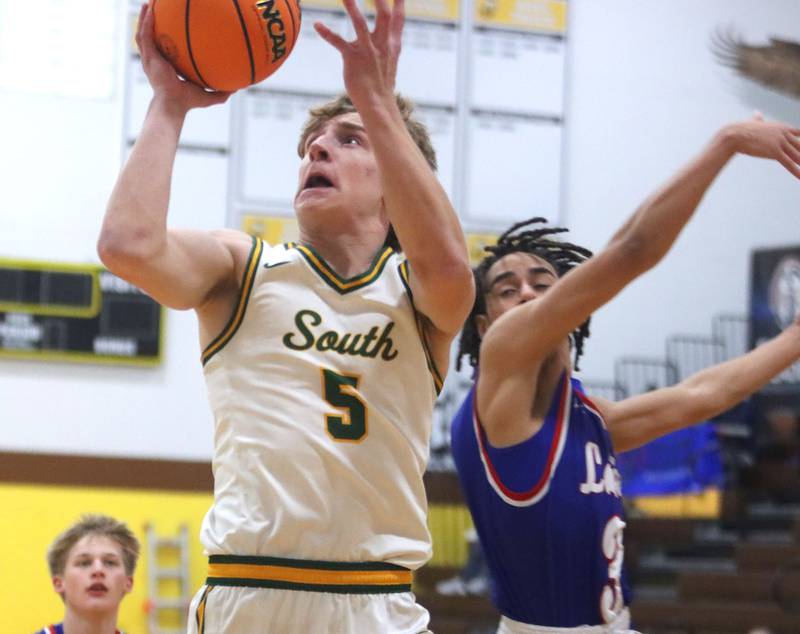 Crystal Lake South’s Carson Trivellini heads for the hoop against Lakes  in varsity boys basketball Hinkle Holiday Classic action on Friday, Dec. 26, 2025, at Jacobs High School in Algonquin.