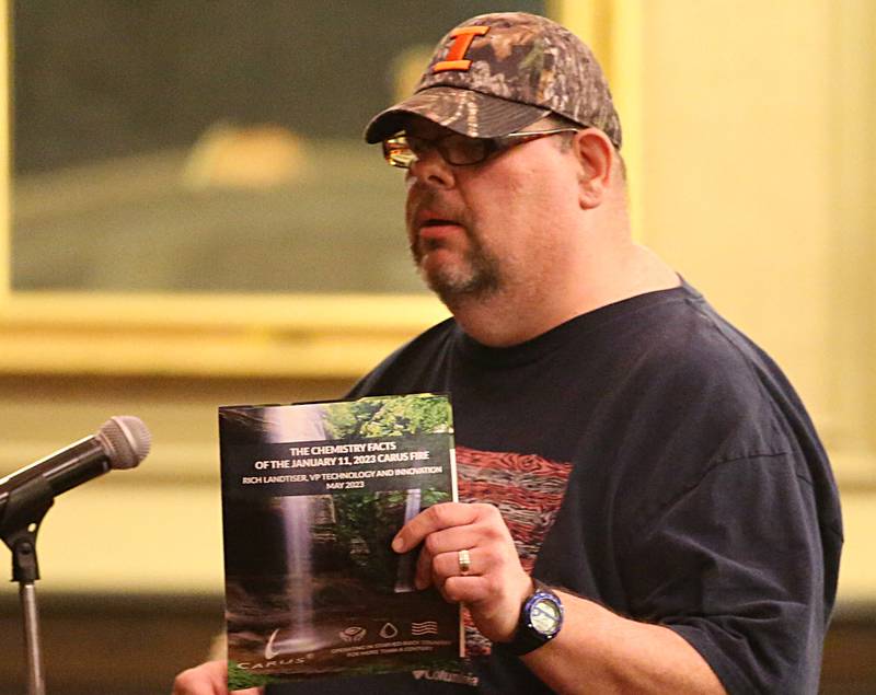 Hazmat instructor Eric Dyas holds a program while speaking during the Carus town hall meeting on Wednesday, May 10, 2023 in Matthiessen Auditorium at LaSalle-Peru Township High School. Dyas, is concerned that Carus isn't following proper protocols.