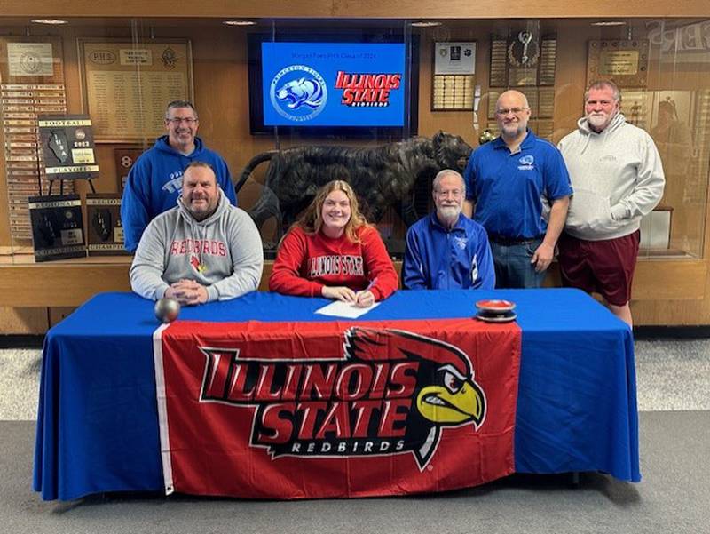 Princeton High School senior Morgan Foes signs with the Illinois State University track and field team on Tuesday. She was joined by (front, from left) her dad, PHS boys track coach Dan Foes, and PHS head girls track coach Pat Hodge; and (back row) PHS assistant track coaches Rob Jensen, Curtis Odell and Paul Miller.