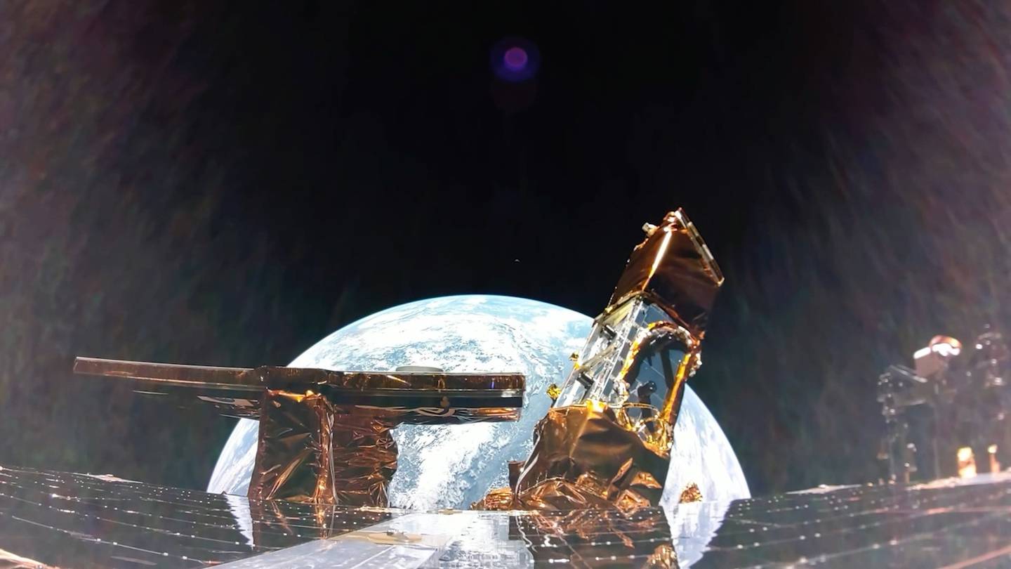 Photo of Earth with the moon in the distance, taken from aboard the Blue Ghost lunar lander on Jan. 31, 2025.