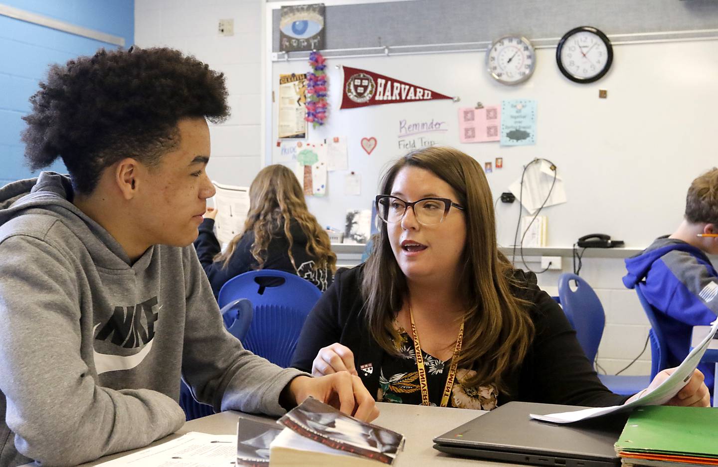 Megan McDaniel, who recently received her Master of Arts degree from Harvard University, works with Jacobe King as she teaches a literacy class Wednesday, April 19, 2023, at Northwood Middle School in Woodstock.
