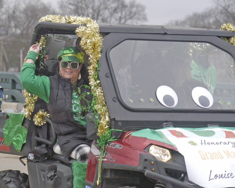 A representative for honorary parade marshal Louise Corken throws candy from from a float Saturday, March 15, 2025, in the Dixon St. Patricks parade. Corken, a long time Dixon resident, died earlier this year.