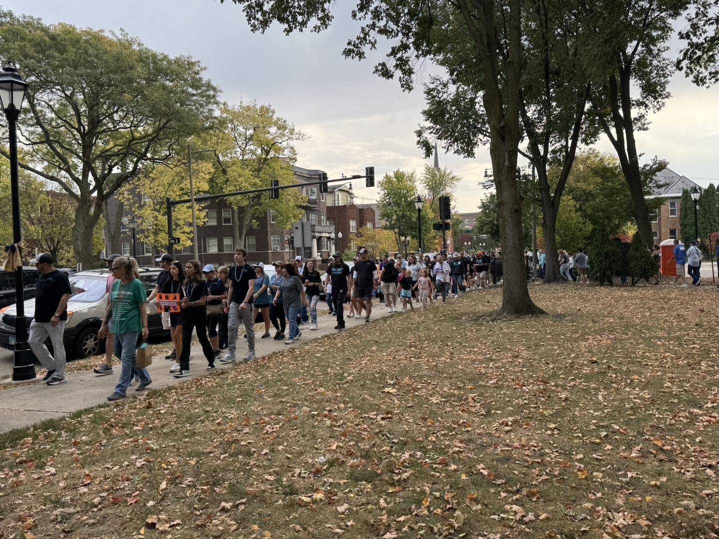 More than 200 people gathered at Washington Square in Ottawa for the annual Out of the Darkness Walk, which included a morning run, a mental health resource fair, family activities and a memorial walk.