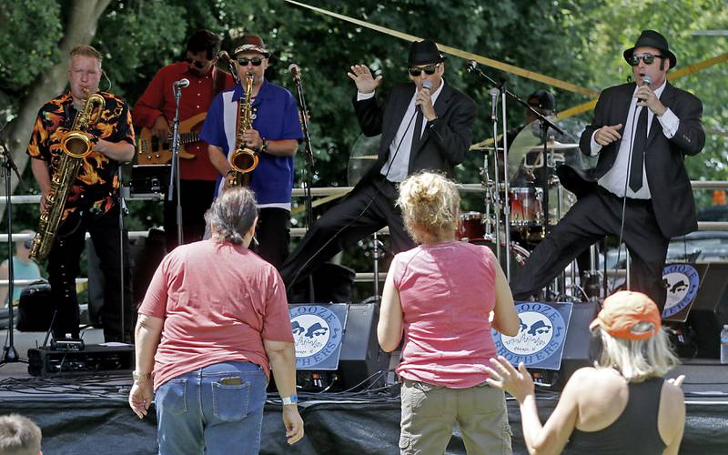 People enjoy the music of the Booze Brothers during Lakeside Festival on Friday, July 5, 2024, at the Dole.